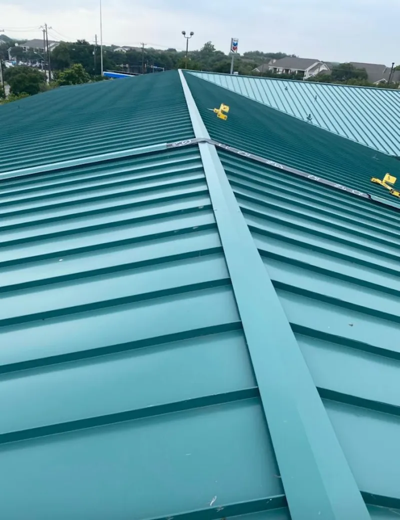 Green commercial metal roof ridge and valley for Metal Roof Repair in Charlestown