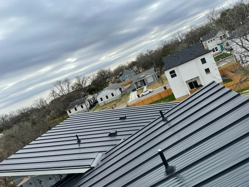 Standing seam metal roof panels with vents for Skylight Repair in Charlestown
